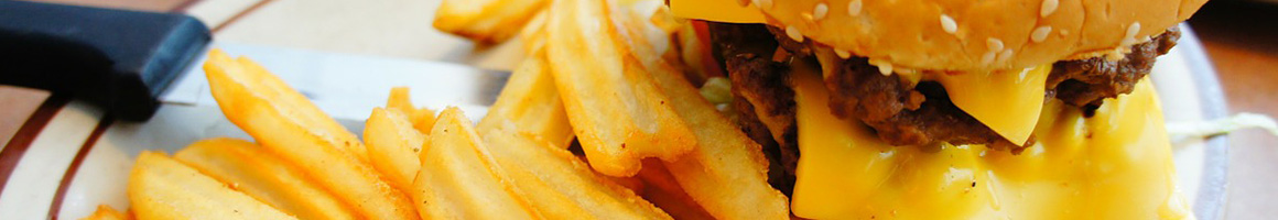 Eating Burger Fast Food Hawaiian at Cafe 100 restaurant in Hilo, HI.